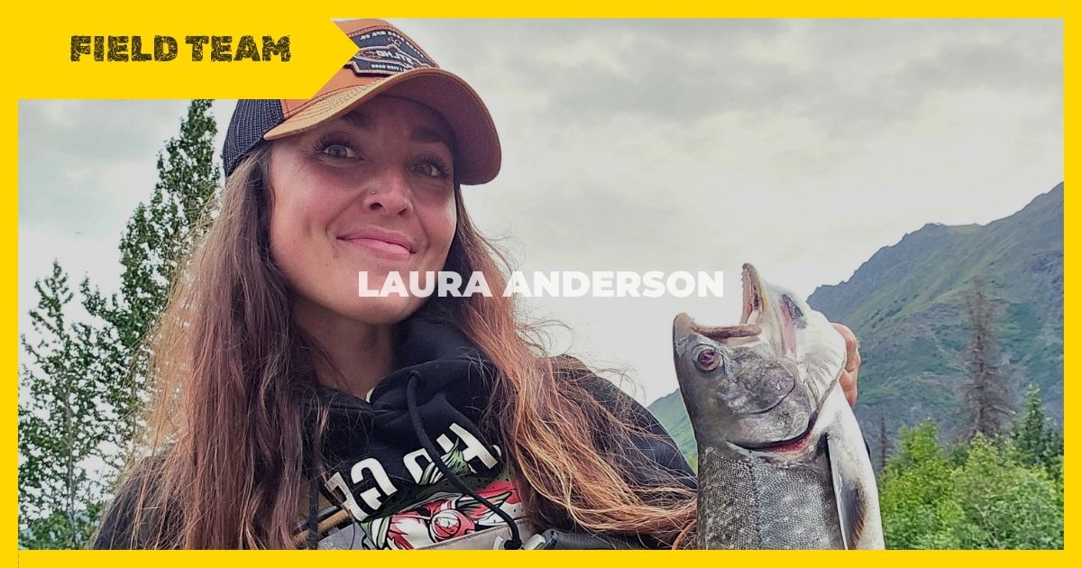 laura anderson holding a fish outdoors