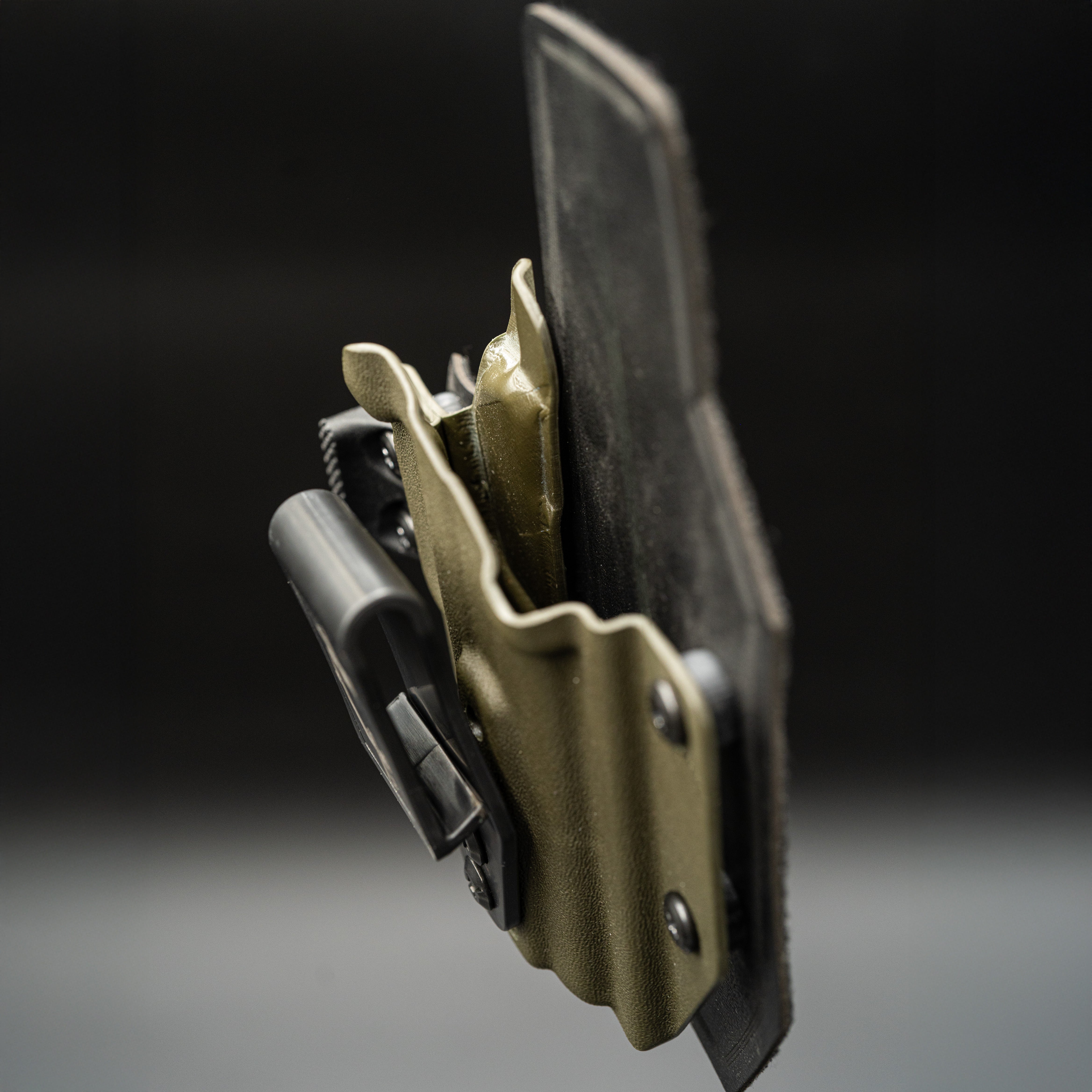 Outlaw IWB(inside the waistband) on a dark background