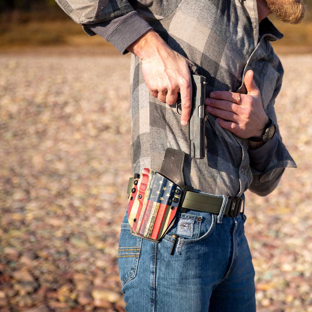 Person wearing an ULTRA COMFORTABLE CONCEALED CARRY outlaw owb(outside the waistband) holster