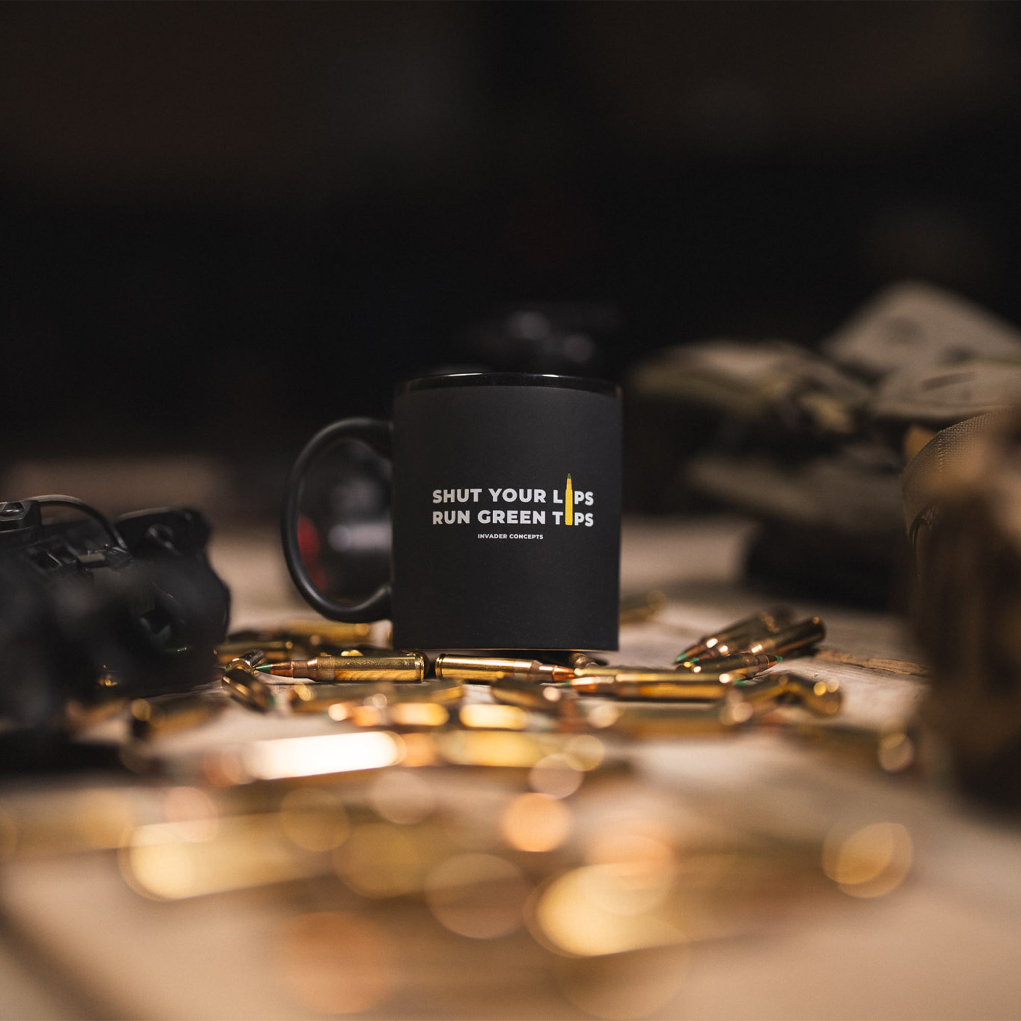 Black mug with text on a table with blurred background