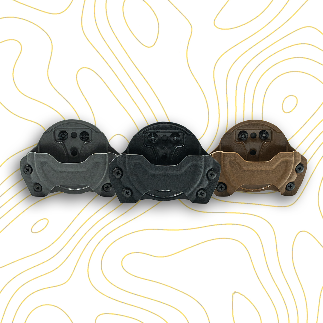 Three nic pouch sheaths in gray, black, and brown on a topographic map background