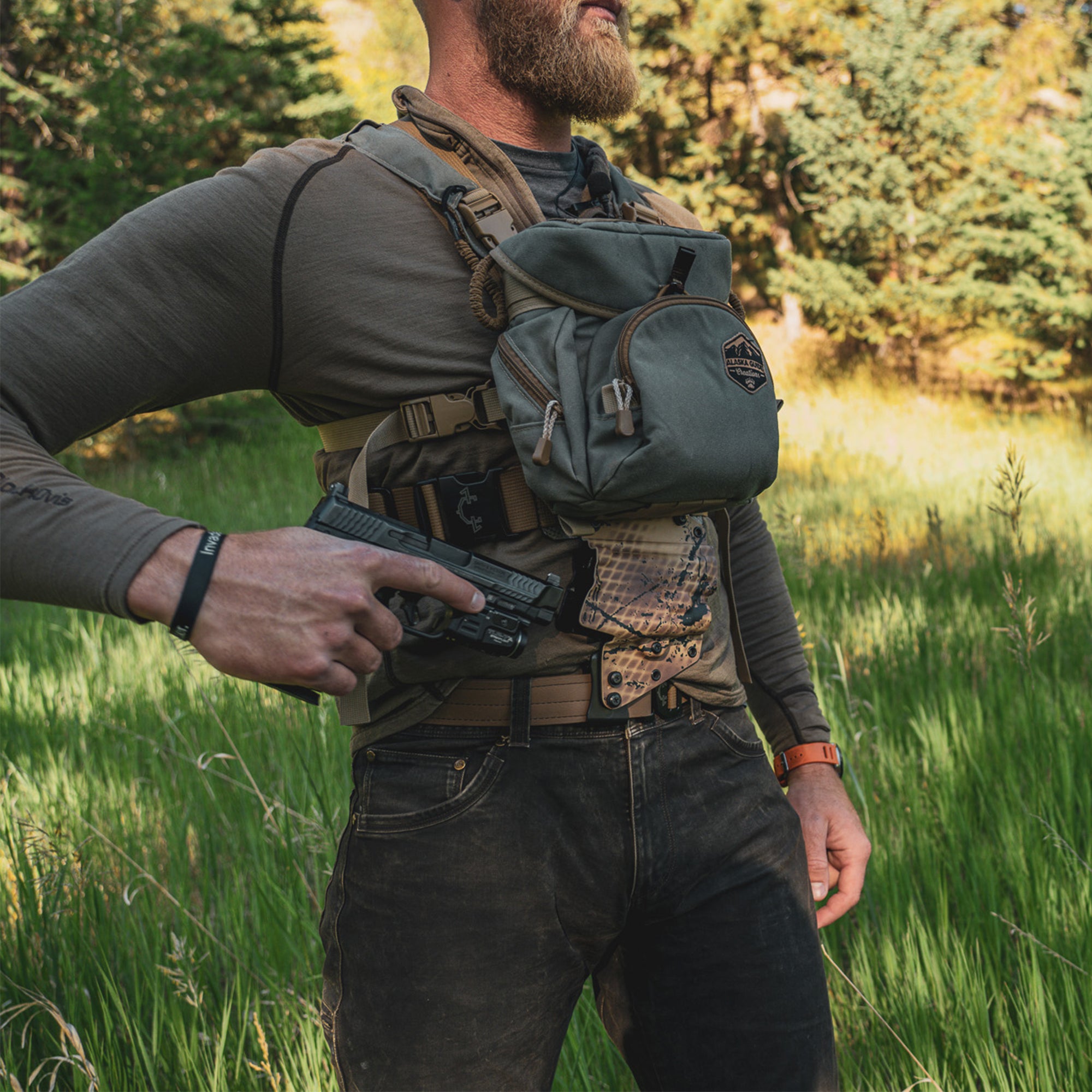 Man in outdoor setting with tactical gear and guide torso holster