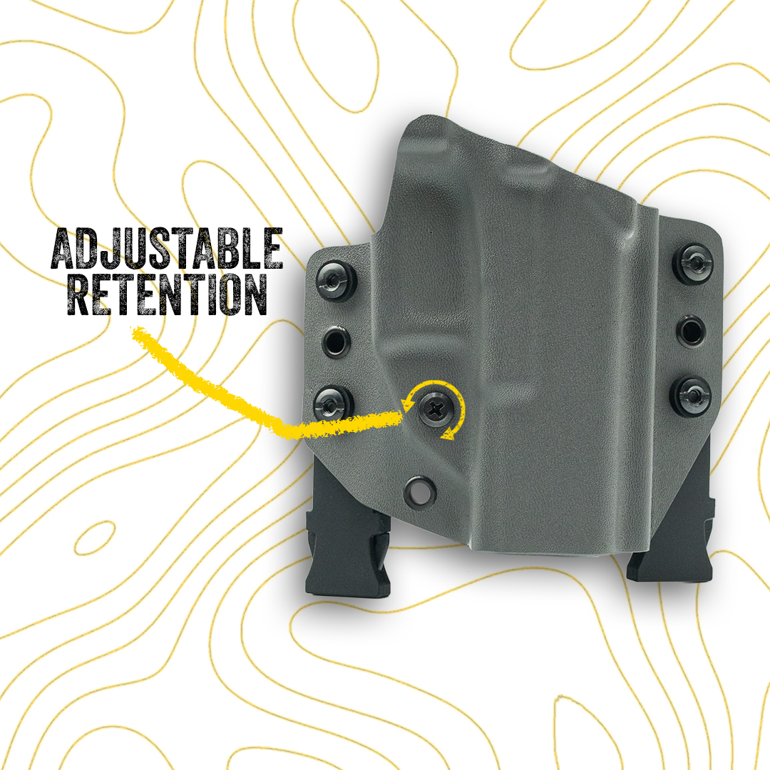 Gray holster with adjustable retention feature on a white background with yellow lines.